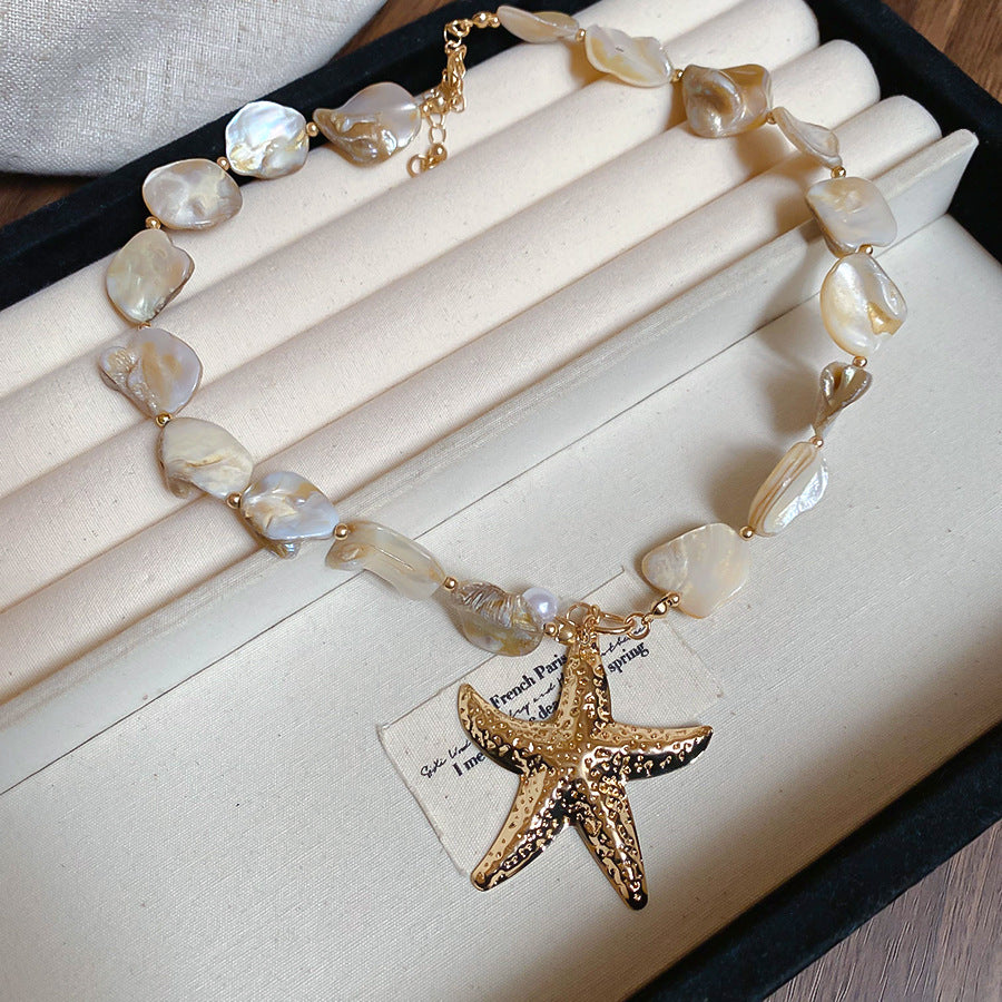 White shell necklace with gold starfish