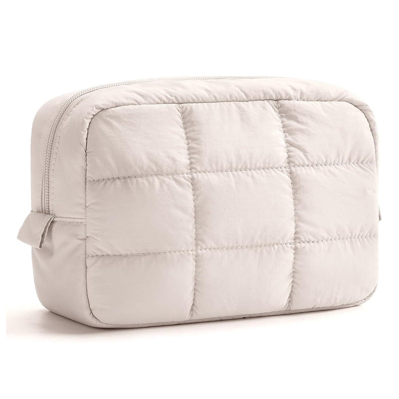 Ivory quilted makeup pouch