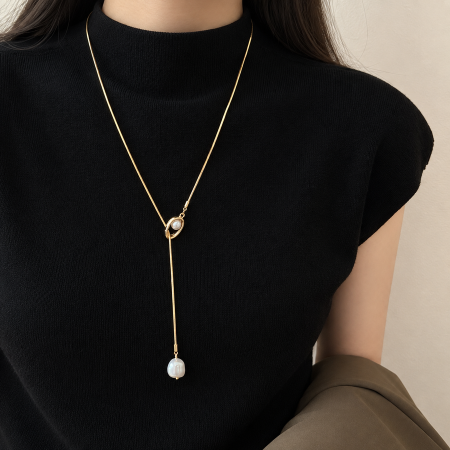 Pearl-Look Lariat Necklace — Gold-tone necklace worn with a blazer, clothing not included