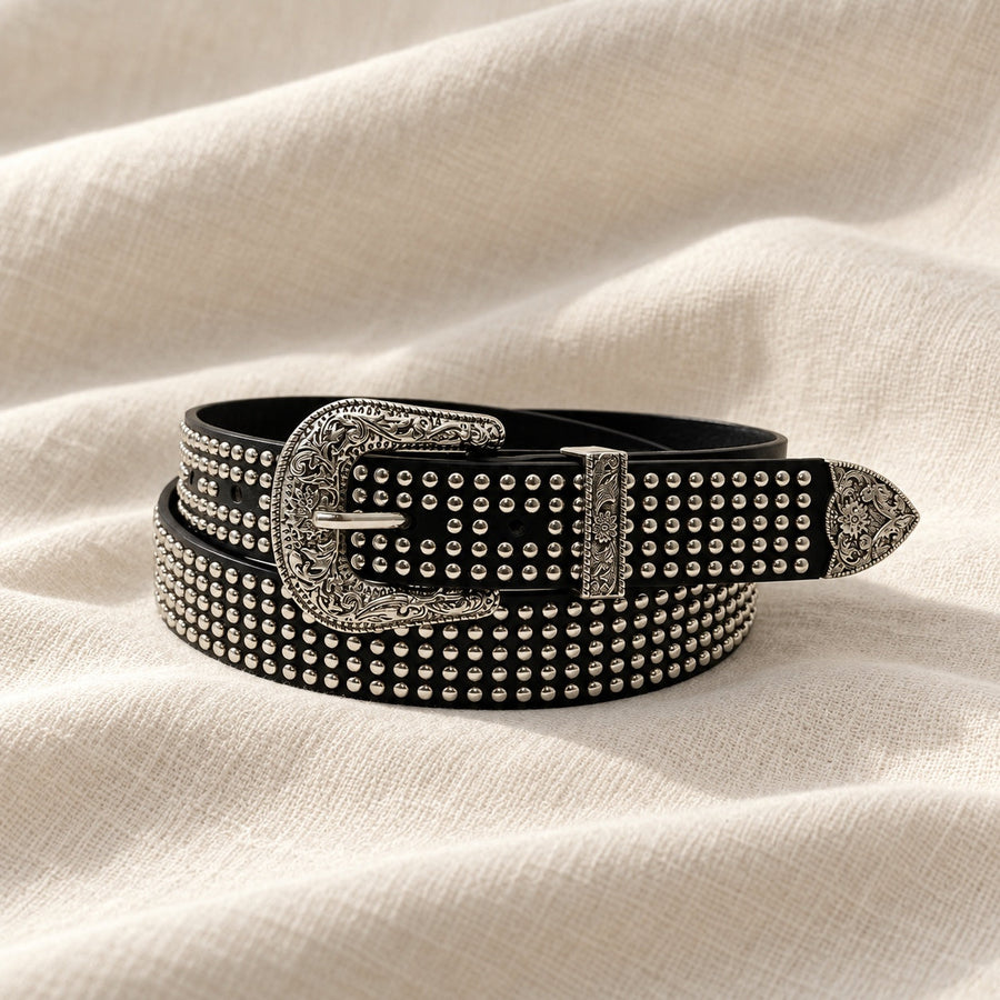 Black western studded belt on ivory linen