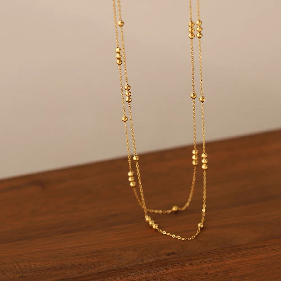 Gold beaded double-layer necklace detail