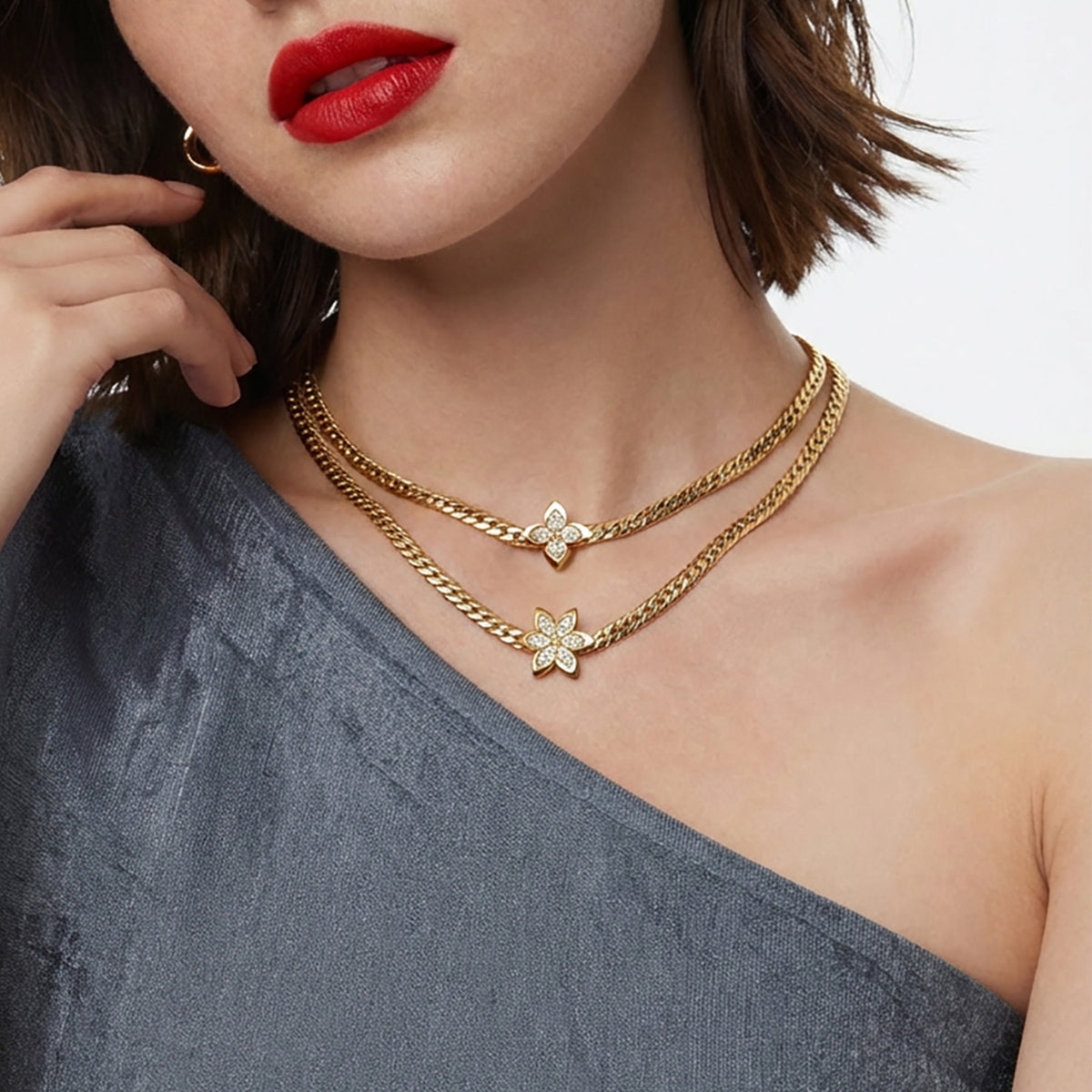 Gold flower zircon necklace worn layered