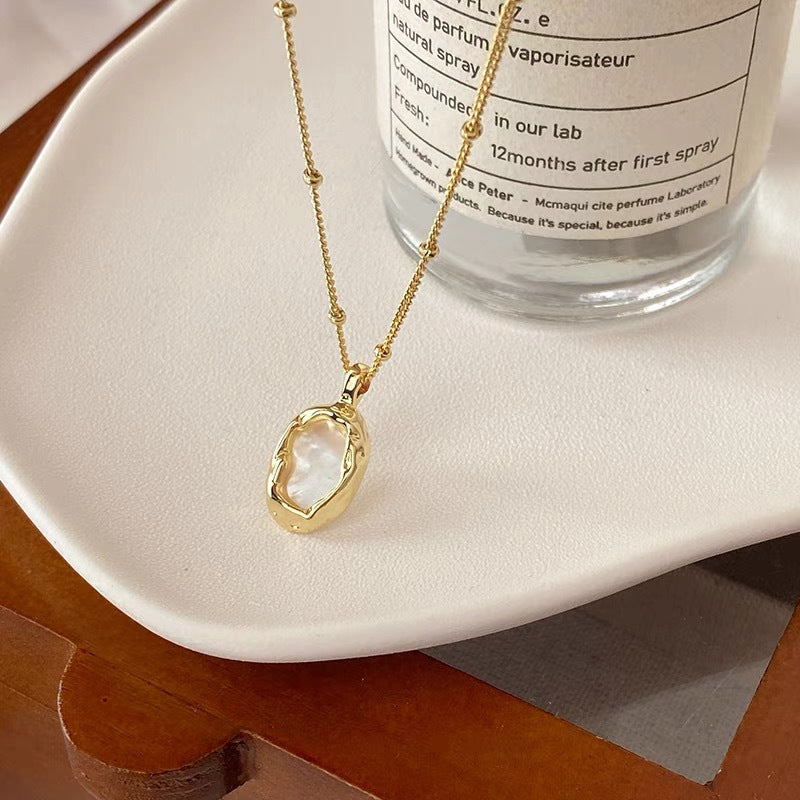 Gold geometric shell pendant necklace